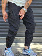 Jogger Utility – Black – worn – black tactical cargo jogger pants with side zip pockets and ankle zippers
