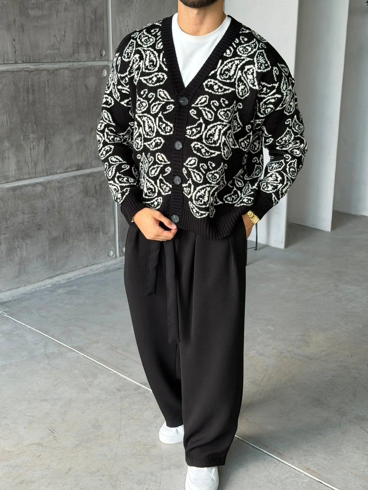 Gilet Triko Paisley – Noir – worn – full front view of model wearing black paisley knit cardigan sweater