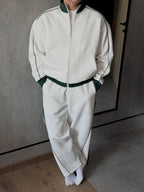 Tracksuit Set – Ivory – Blanc – worn – full length view of ivory tracksuit with green contrast trim