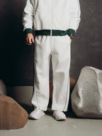 Tracksuit Set – Ivory – Blanc – worn – lower body view showing wide leg pants with front piping details