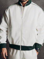 Tracksuit Set – Ivory – Blanc – detail – close-up of front zip jacket, green collar, cuffs, and hem trim