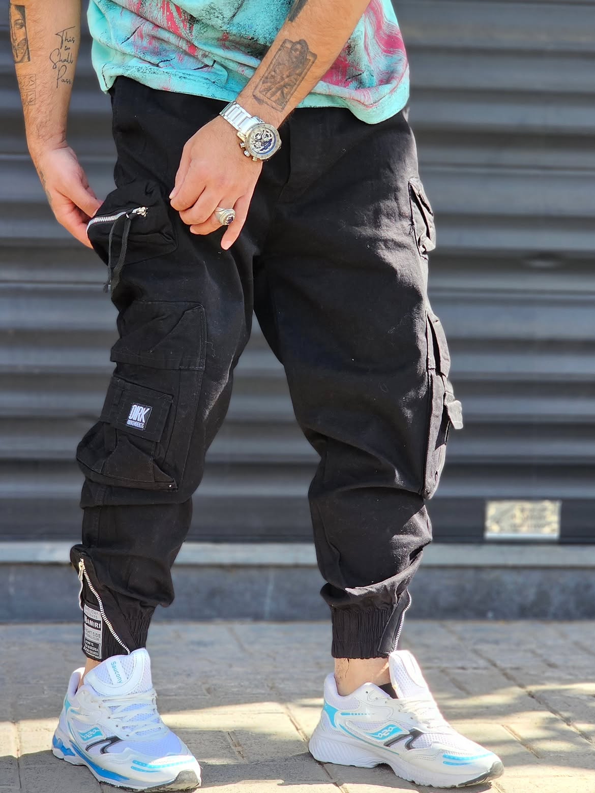 Jogger Pant Vibe – Black – worn – black cargo jogger pants with multiple utility pockets and ankle zips
